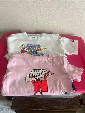 Nike Kids Pink Graphic Tee with Red Character Logo